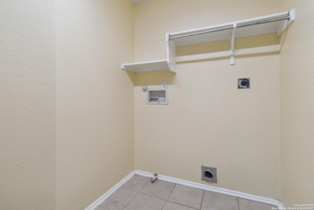 clothes washing area featuring electric dryer hookup, washer hookup, hookup for a gas dryer, and light tile patterned floors