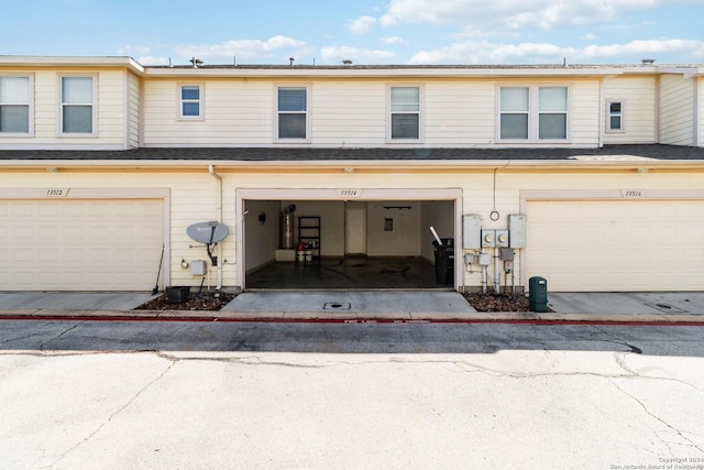 townhome / multi-family property featuring a garage