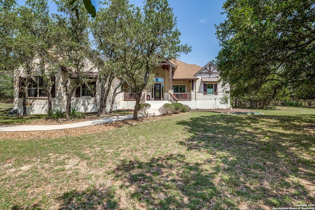 view of front of house with a front lawn and stucco siding