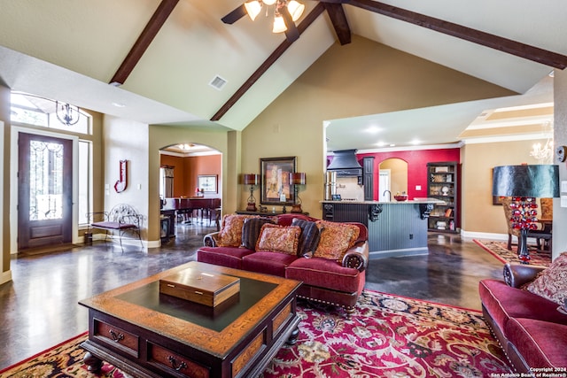 living room with beamed ceiling, high vaulted ceiling, and ceiling fan