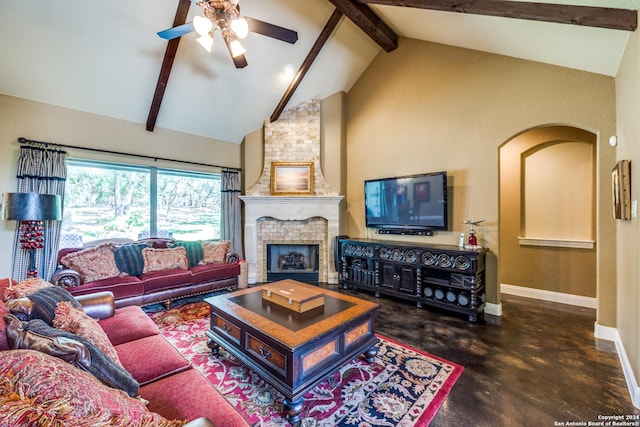 living room featuring baseboards, beamed ceiling, concrete floors, high vaulted ceiling, and a fireplace