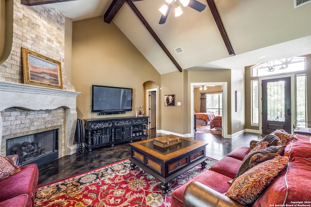 living area featuring high vaulted ceiling, visible vents, baseboards, a brick fireplace, and beam ceiling