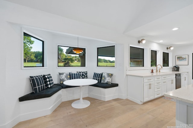 bathroom featuring breakfast area, hardwood / wood-style flooring, and a wealth of natural light