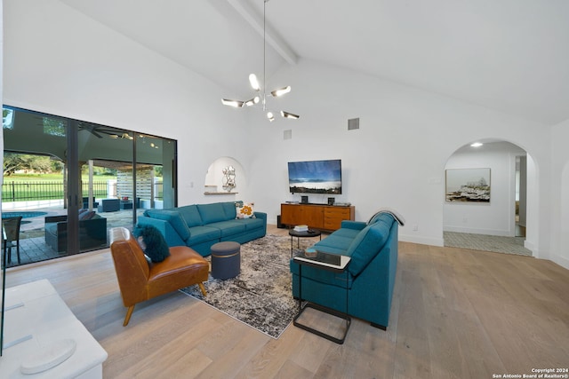 living room with high vaulted ceiling, light hardwood / wood-style floors, a notable chandelier, and beamed ceiling