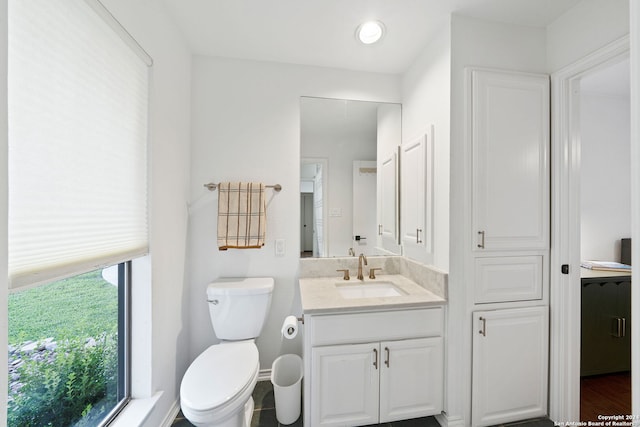 bathroom with vanity and toilet