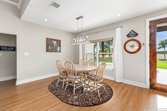 dining area featuring baseboards, visible vents, wood finished floors, and recessed lighting