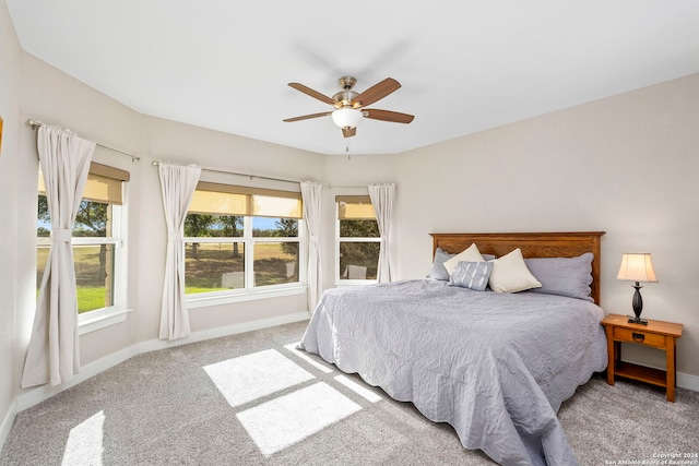 bedroom featuring carpet floors, a ceiling fan, and baseboards