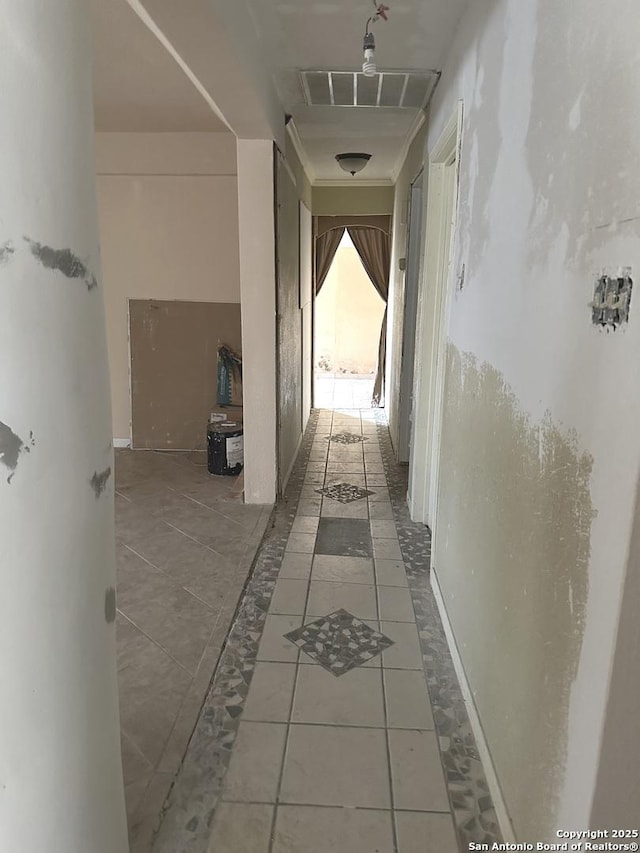 hallway featuring tile patterned floors