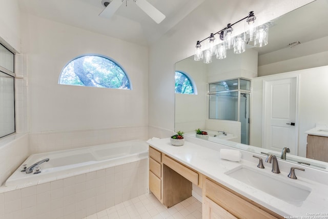 bathroom featuring lofted ceiling, vanity, ceiling fan, plus walk in shower, and tile patterned flooring