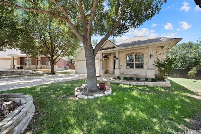 view of front of property with a garage and a front yard