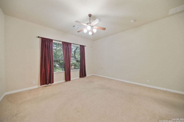 spare room featuring ceiling fan and carpet flooring