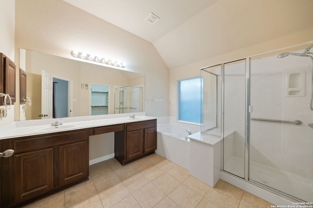 bathroom with vaulted ceiling, tile patterned flooring, shower with separate bathtub, and vanity