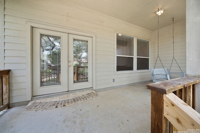 doorway to property featuring a patio area and french doors