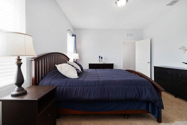 carpeted bedroom with visible vents