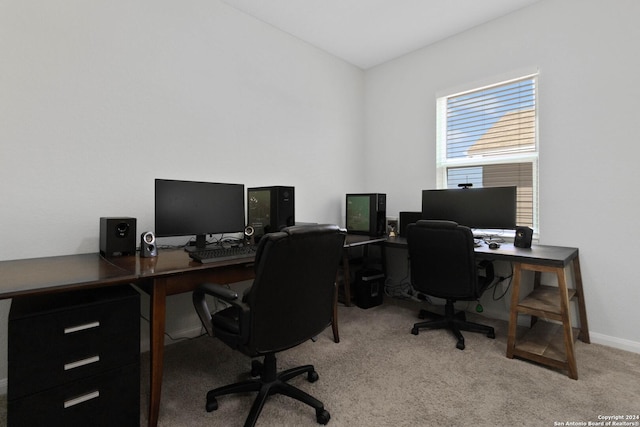 office space featuring baseboards and light colored carpet