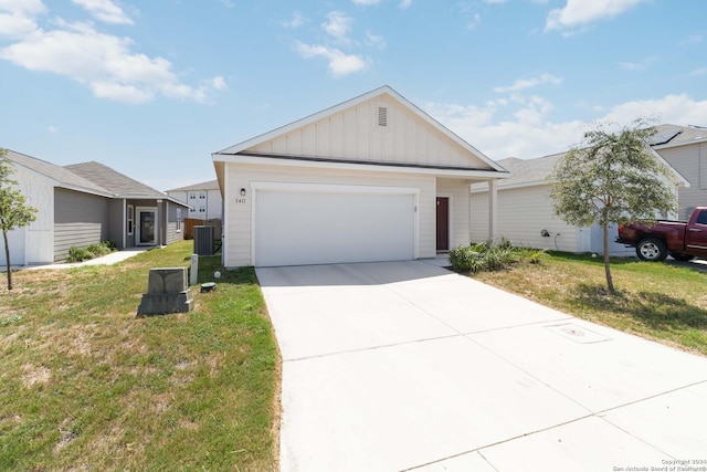 single story home with a garage, a front lawn, board and batten siding, and concrete driveway