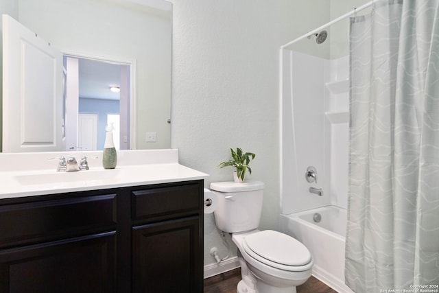 full bath with wood finished floors, vanity, toilet, and shower / tub combo with curtain