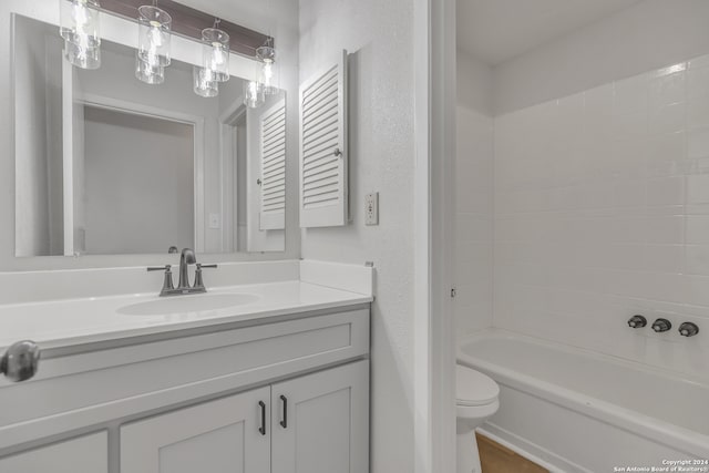 full bathroom with vanity, shower / bath combination, and toilet