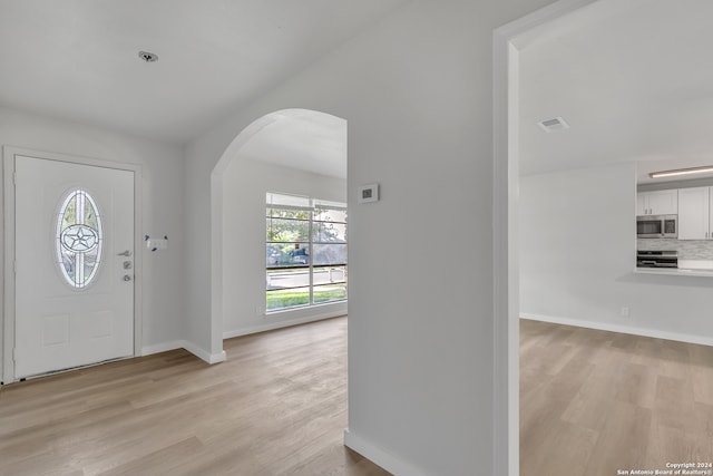 foyer with light hardwood / wood-style floors