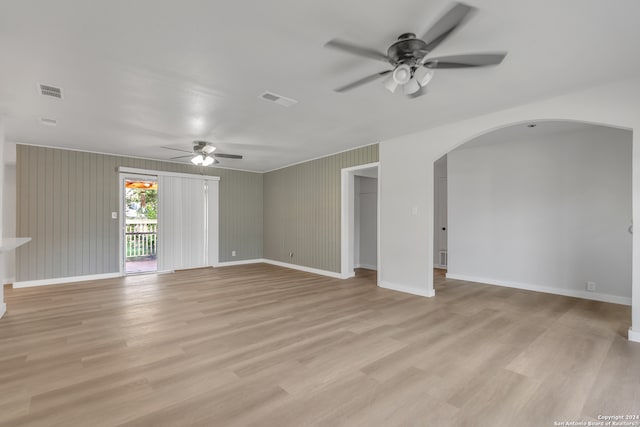 spare room featuring light hardwood / wood-style floors and ceiling fan