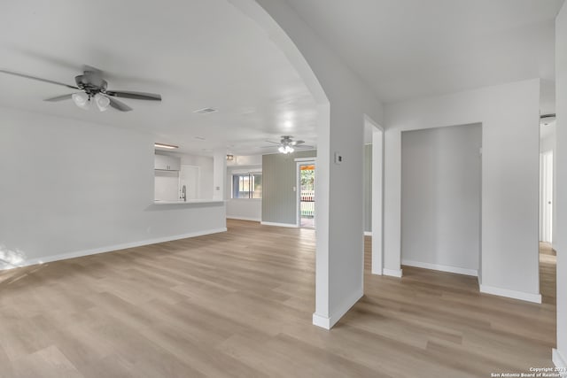 spare room featuring light hardwood / wood-style floors, sink, and ceiling fan