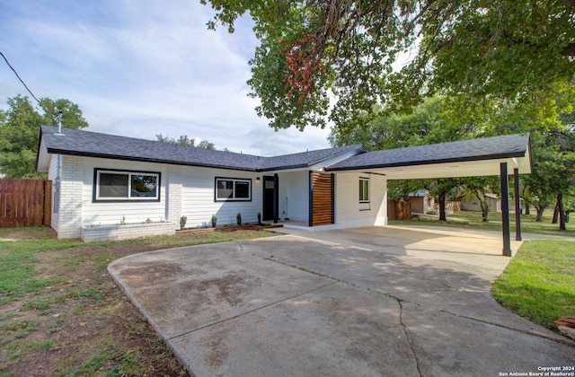 ranch-style house with a carport