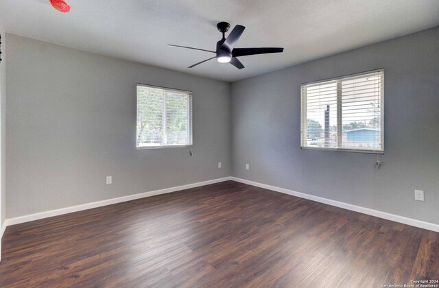 empty room featuring ceiling fan and hardwood / wood-style floors