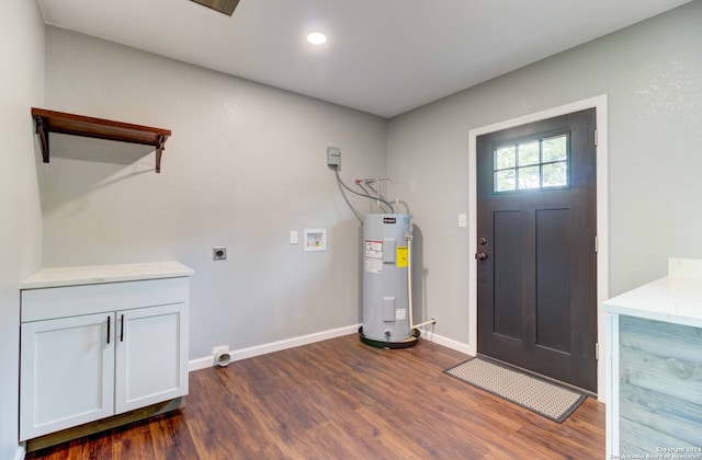 foyer with electric water heater and dark hardwood / wood-style floors