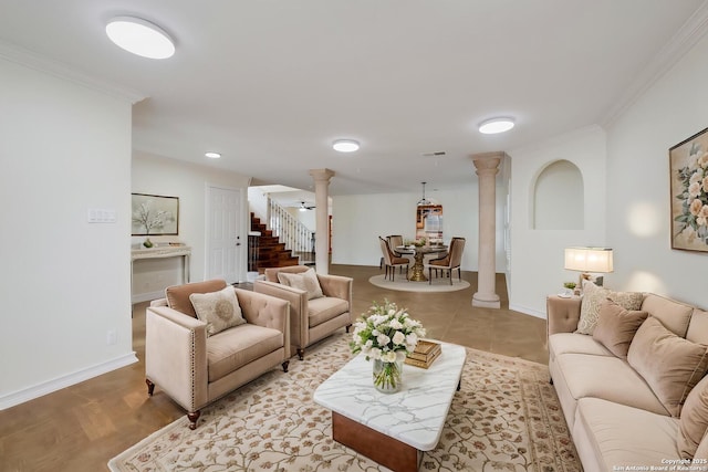 living room with stairway, visible vents, baseboards, ornamental molding, and ornate columns