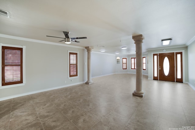 interior space featuring ceiling fan, a healthy amount of sunlight, ornate columns, and ornamental molding