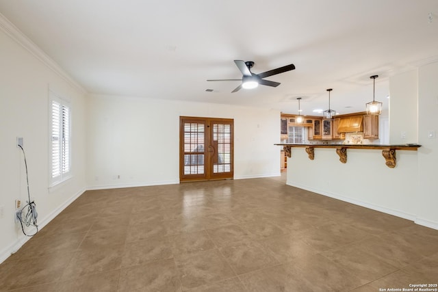 unfurnished living room featuring ceiling fan, visible vents, baseboards, ornamental molding, and french doors