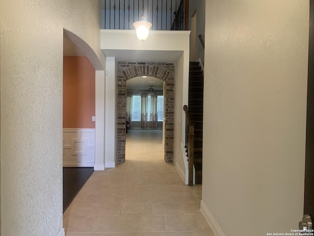 corridor with tile patterned flooring