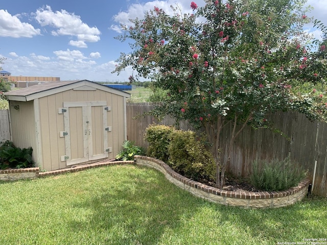 view of outdoor structure featuring a lawn