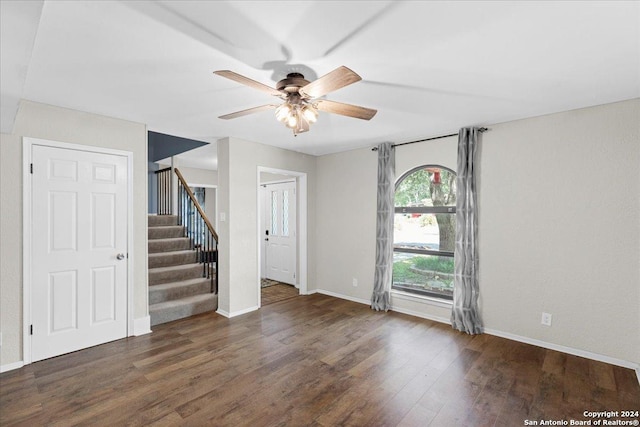 interior space with ceiling fan and dark wood-type flooring