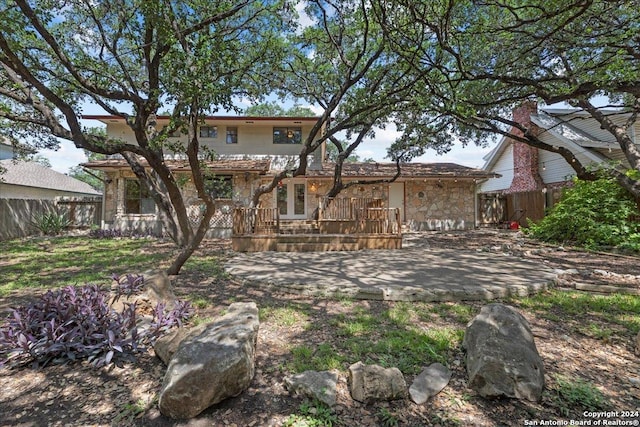 rear view of house with a patio