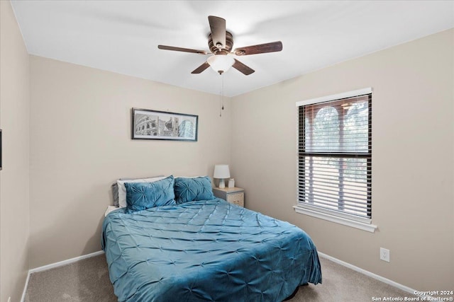 bedroom with ceiling fan and carpet floors