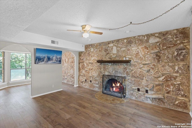 unfurnished living room with ceiling fan and wood-type flooring