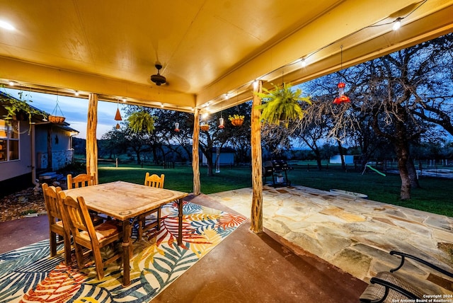 patio terrace at dusk with a yard