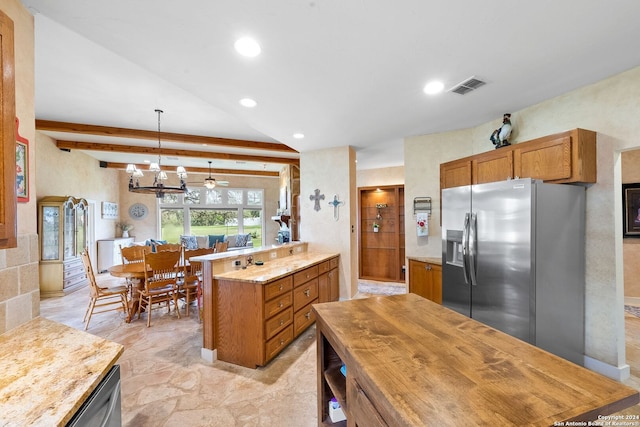 kitchen with vaulted ceiling with beams, an inviting chandelier, kitchen peninsula, stainless steel appliances, and pendant lighting