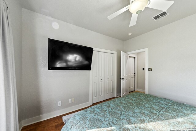 bedroom featuring wood-type flooring and ceiling fan