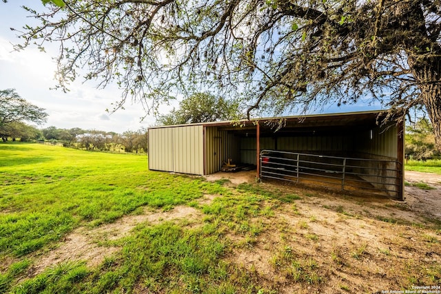 view of pole building with a yard