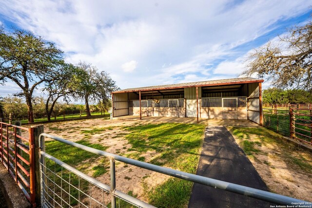 view of outbuilding with a rural view