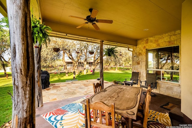 view of patio featuring ceiling fan