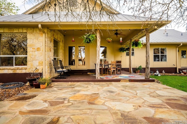 exterior space with ceiling fan and french doors