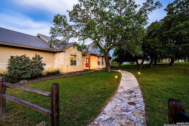 view of home's exterior with a lawn