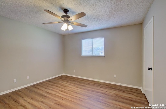 unfurnished room with a textured ceiling, ceiling fan, and light hardwood / wood-style floors