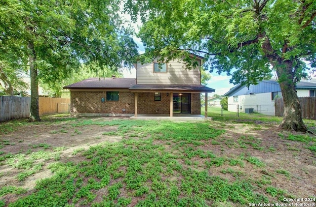 rear view of property with a patio area