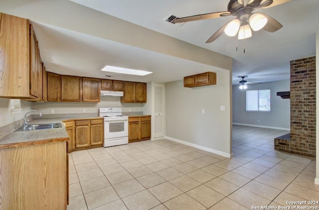 kitchen featuring sink, ceiling fan, white electric range, and light tile patterned flooring