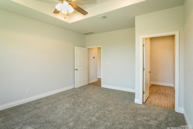 unfurnished bedroom with ceiling fan and carpet flooring