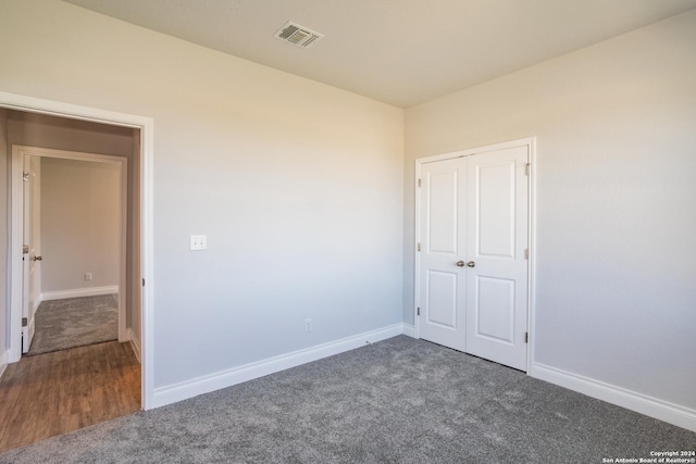 empty room with dark carpet